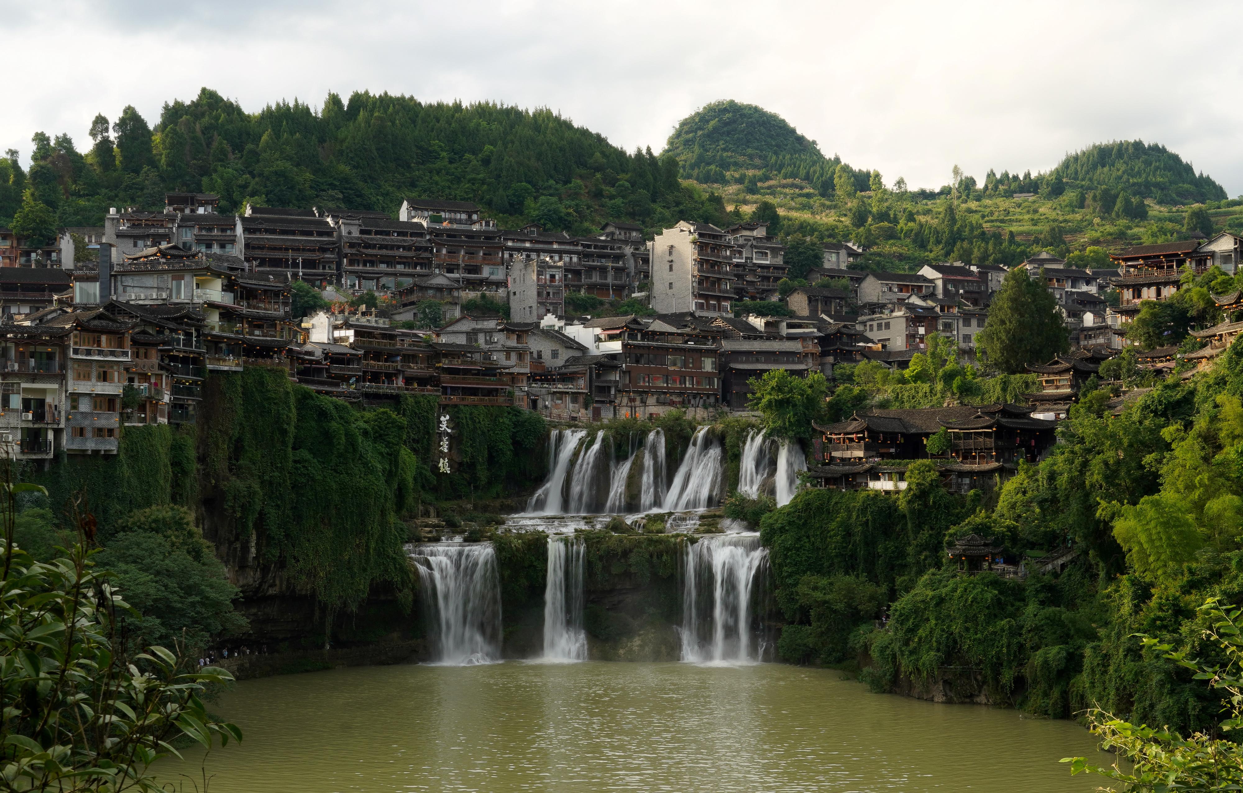 Village built into the mountains over a waterfall.
