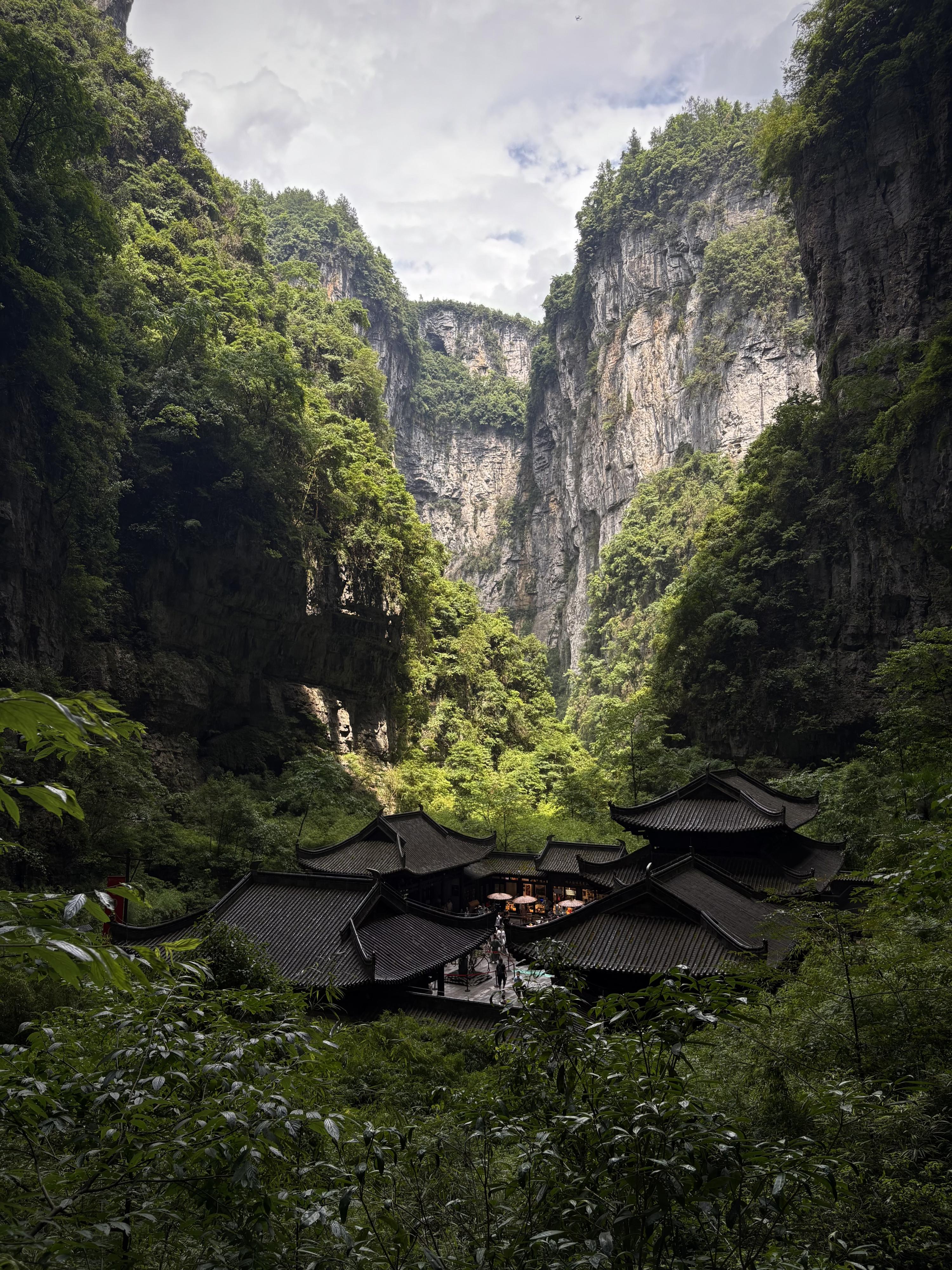 Traditional village nestled in the valley surrounded by mountains.