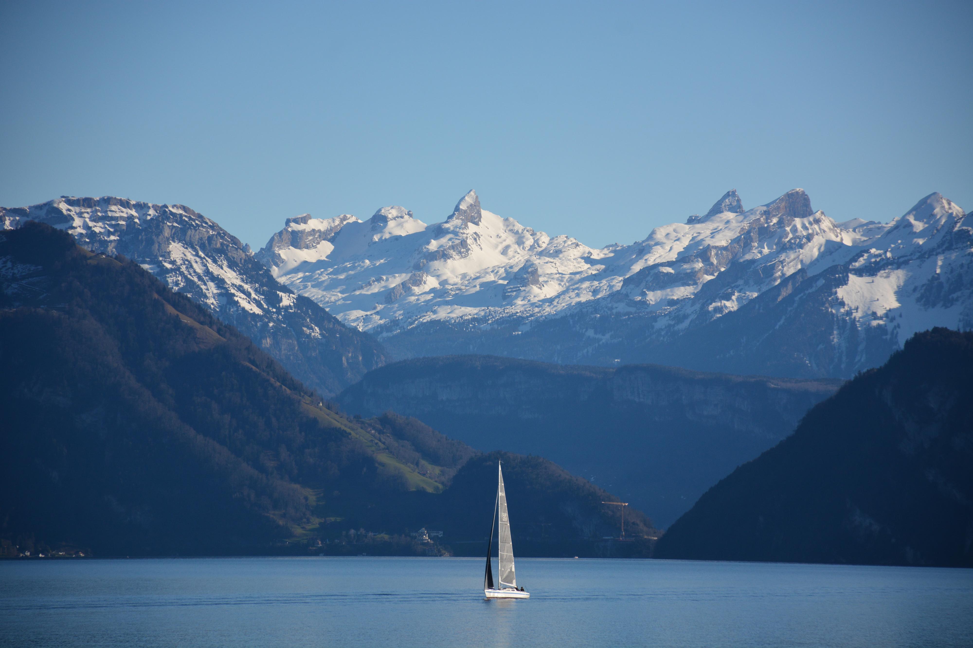 Sailboat on Lake Lucerne with the mountains in the background. 